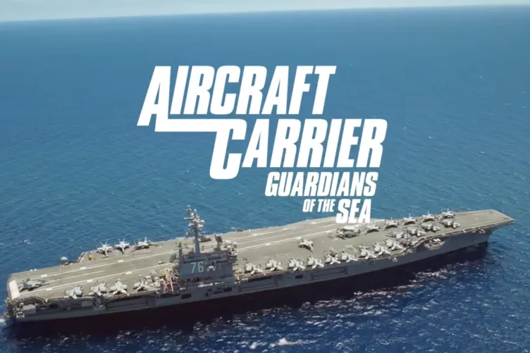 An aircraft carrier in the ocean with text that says Aircraft Carrier Guardian of the Seas.