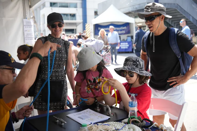 Visitors participating in Fleet Week activities on Pier 86 at the Intrepid Museum 