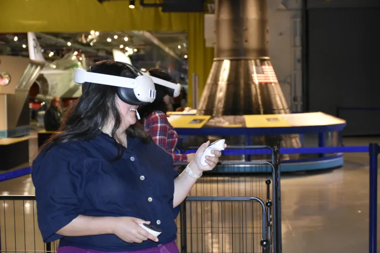 Guest explores the Intrepid's engine room through an immersive VR experience