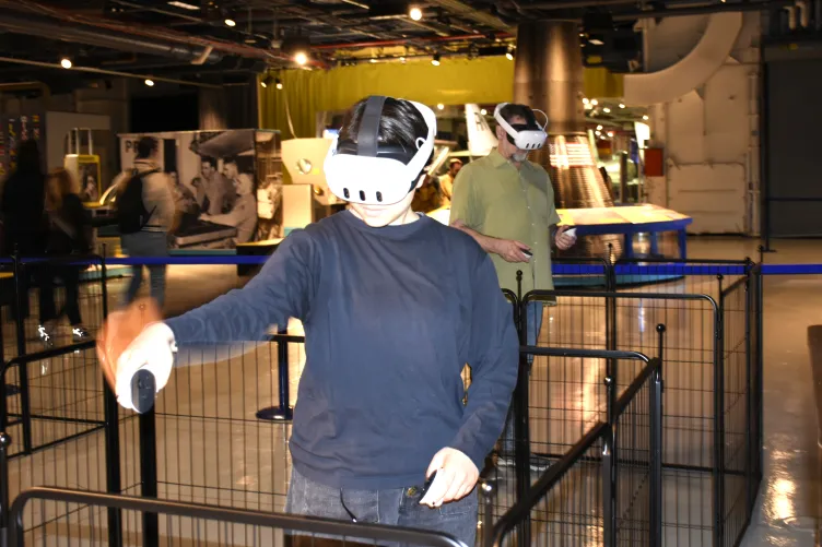 Guest explores the Intrepid's engine room through an immersive VR experience