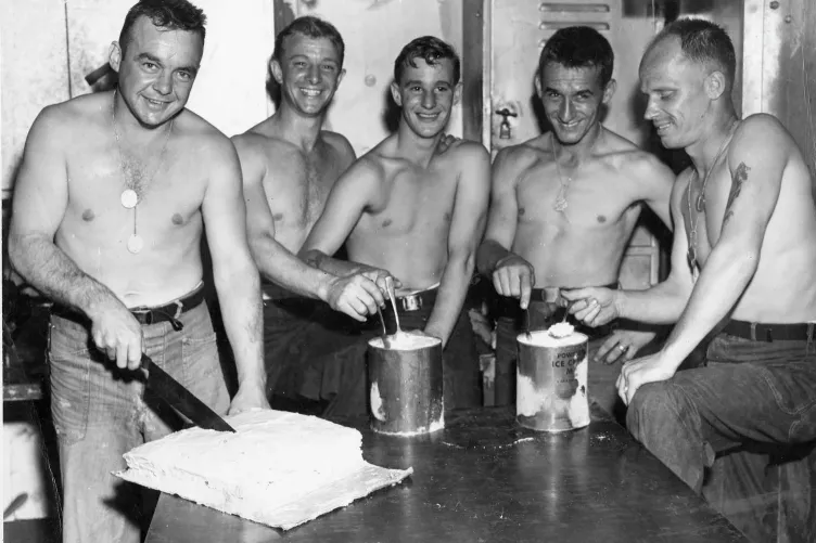 Sailors on the USS Bunker Hill get ready to enjoy some ice cream and cake. Credit: U.S. Naval Institute Photo Archive 