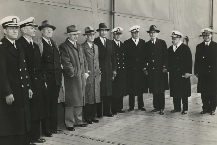 Clark, fifth from the left, and other officials at the commissioning of USS Yorktown in 1943. Alongside the admirals are two politicians from Clark’s home state: J.B. Milam, chief of the Cherokee Nation, and Wesley E. Disney, an Oklahoma congressman.