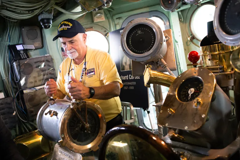 A veteran in the Intrepid's helm.