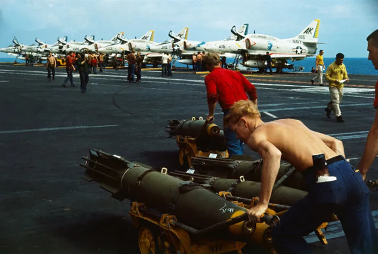 Archival photo of soldiers on the flight deck during the Vietnam War