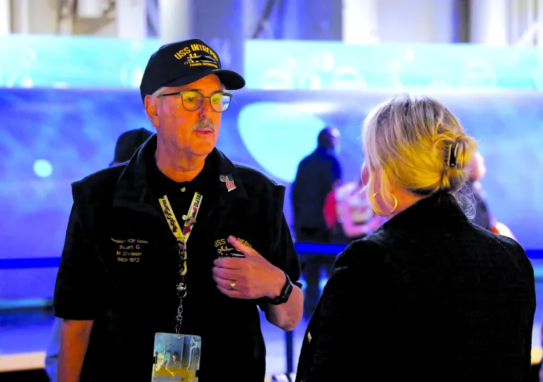 Volunteer speaking to a woman