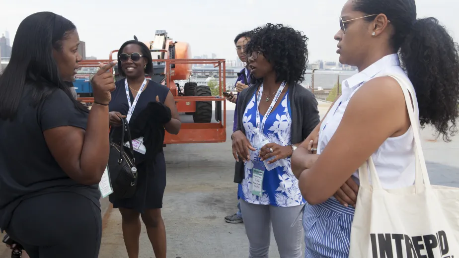 A group of educators at the museum participating in activities.