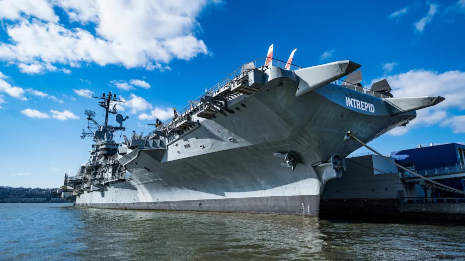The Intrepid Museum tied to a pier.