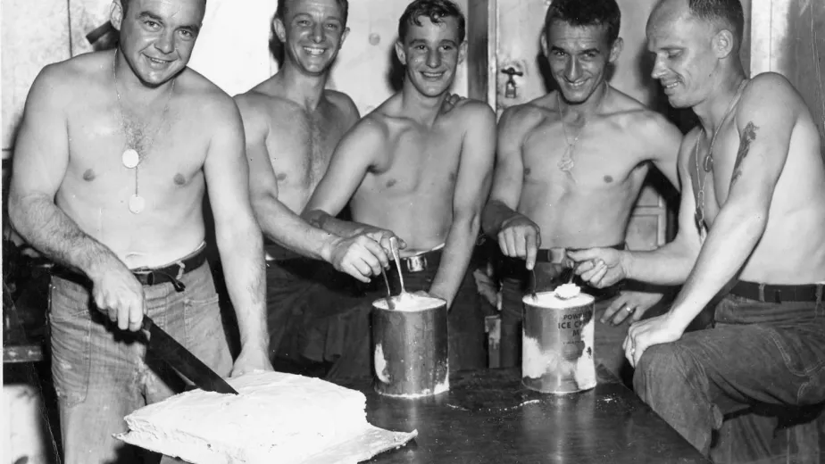 Sailors on the USS Bunker Hill get ready to enjoy some ice cream and cake. Credit: U.S. Naval Institute Photo Archive 