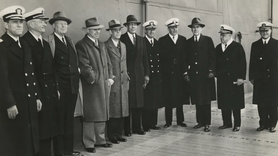 Clark, fifth from the left, and other officials at the commissioning of USS Yorktown in 1943. Alongside the admirals are two politicians from Clark’s home state: J.B. Milam, chief of the Cherokee Nation, and Wesley E. Disney, an Oklahoma congressman.